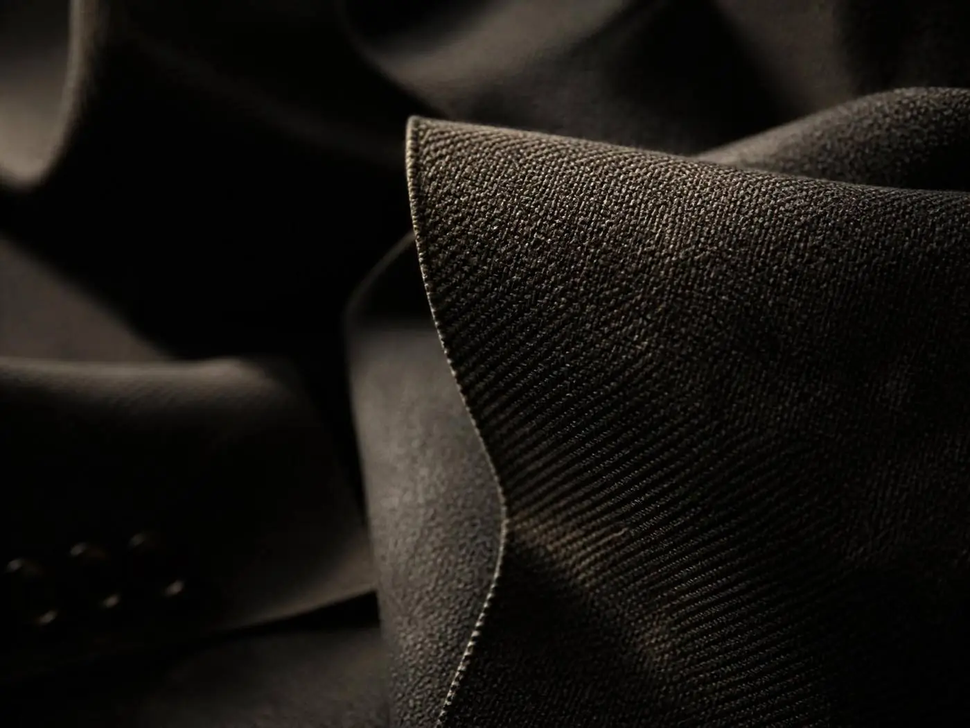 Close-up of dark woven wool suiting fabric